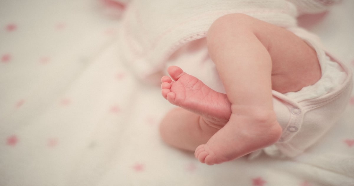 A baby in NICU bed