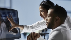 Healthcare professionals reviewing data on a PC Healthcare professionals reviewing data on a PC