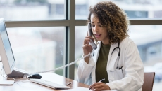 A doctor in a phone call consultation with a patient