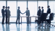 Business people closing a deal Business people closing a deal