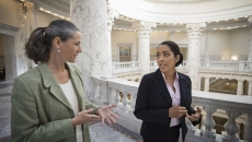 Two legislators talking in the U.S. Capitol