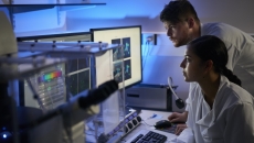 Healthcare professionals reviewing imaging on a PC