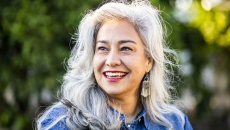 Person with gray hair smiling