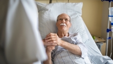 Healthcare professional consulting with patient in the hospital Healthcare professional consulting with patient in the hospital