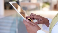 A close up photo of a woman using a tablet A close up photo of a woman using a tablet