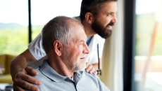 An older man with a companion at home An older man with a companion at home