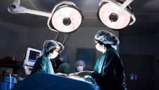 Clinicians performing surgery Clinicians performing surgery
